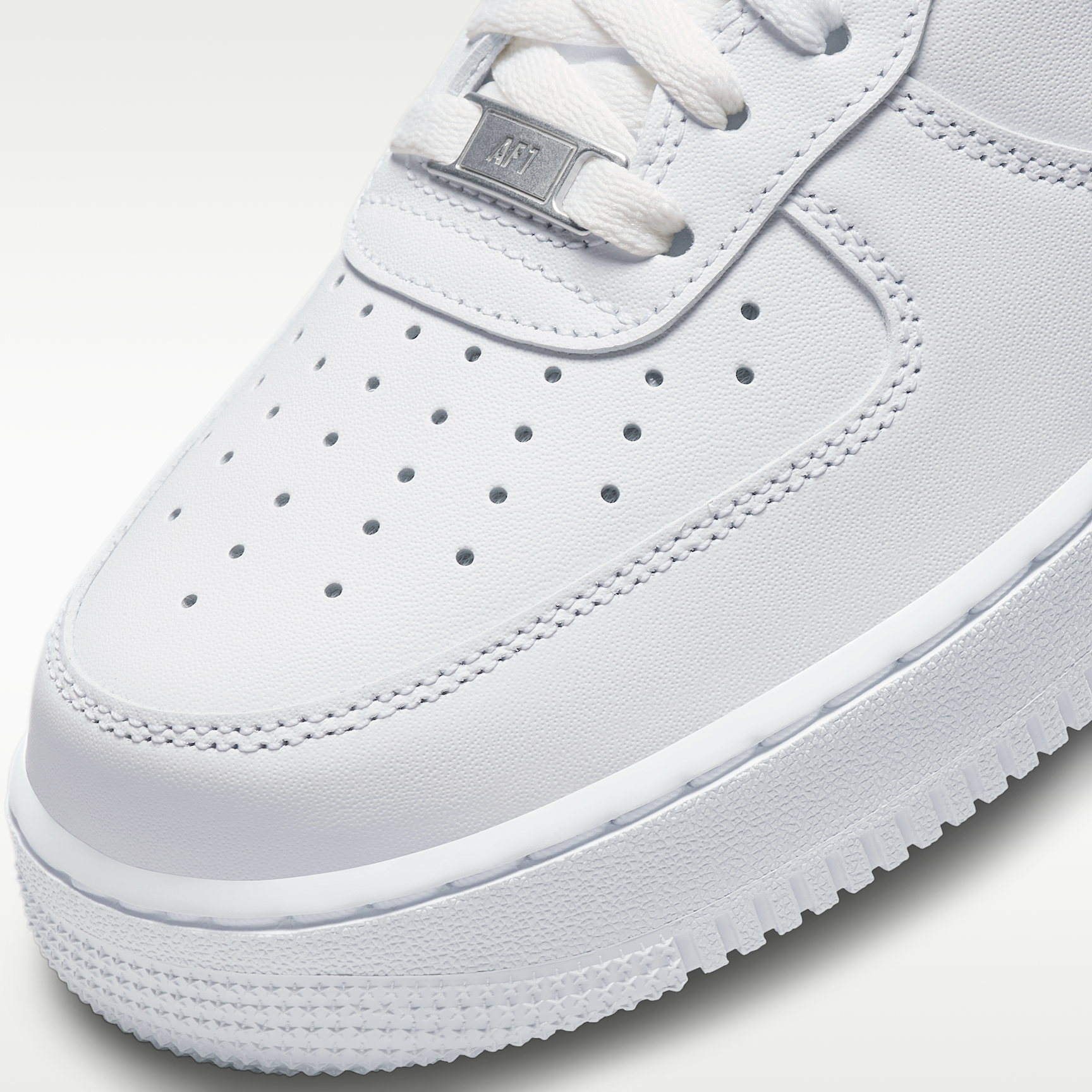 AF1 07 Triple White men's sneaker - toe and lace detail
